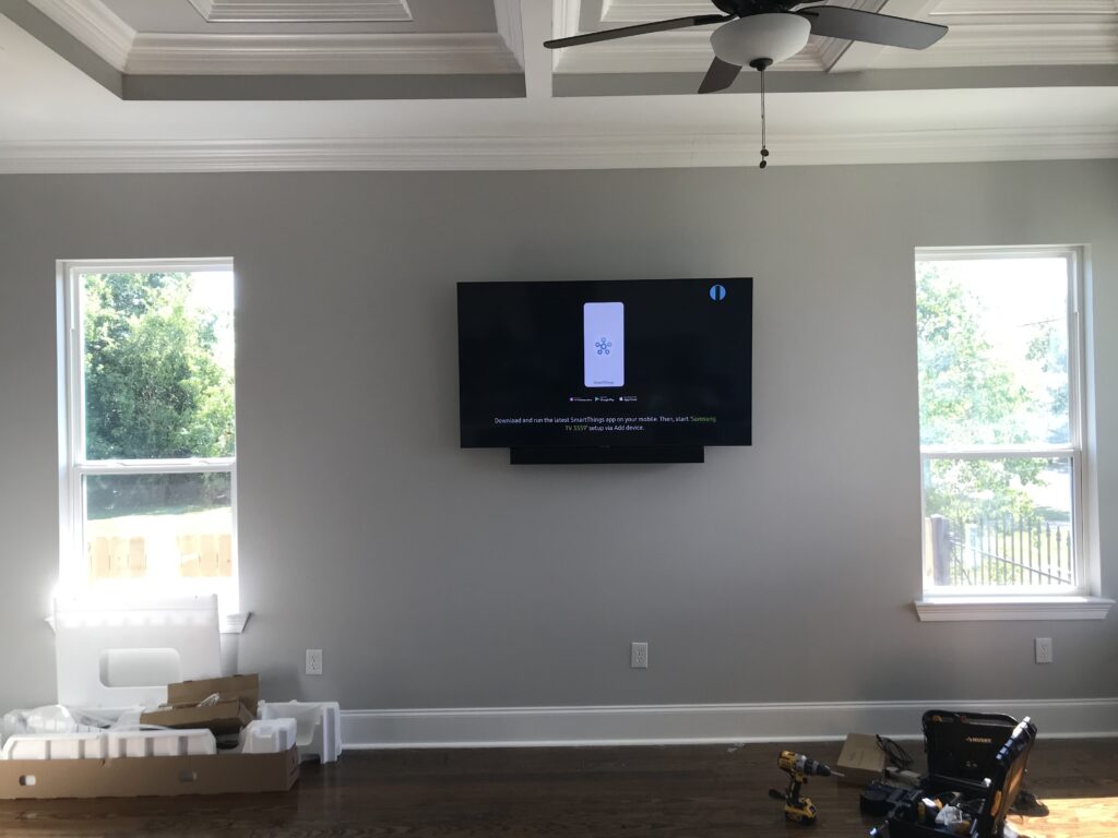 TV mounted with sound-bar attached