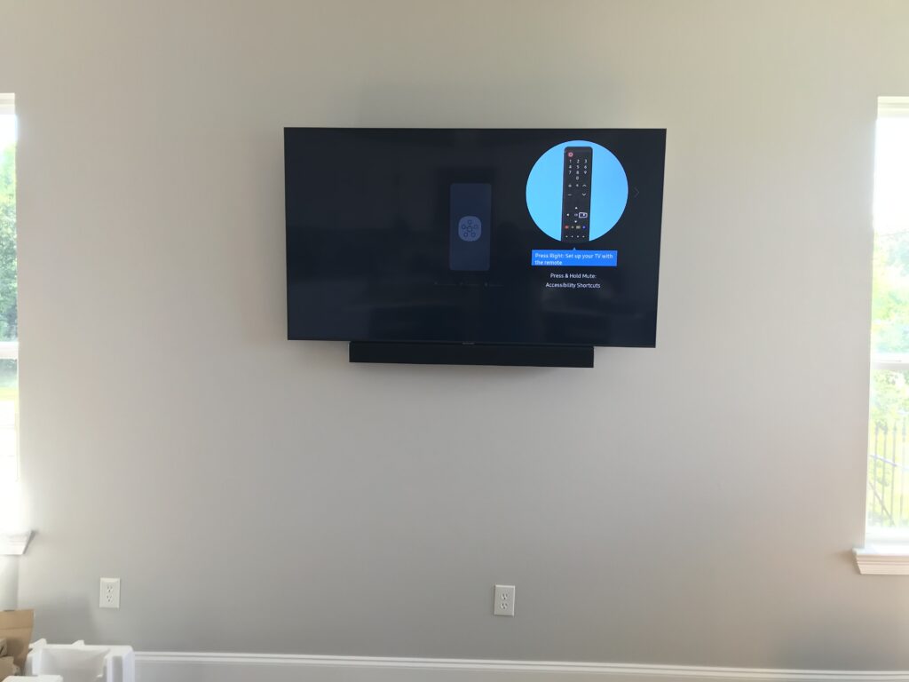 TV mounted with sound-bar attached