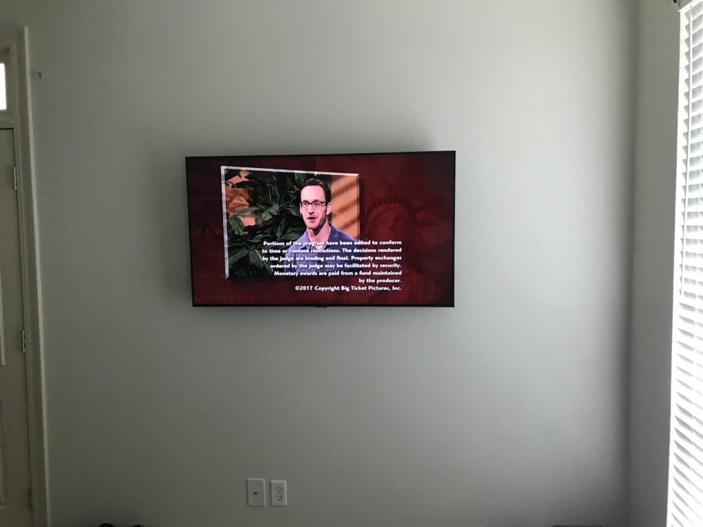 50 TV Mounted on wall with wiring concealed in wall