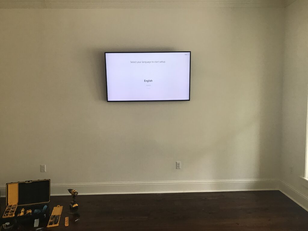 Flat Screen TV mounted on wall with concealed wiring