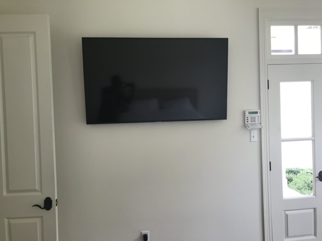 60 Flat Screen TV mounted on wall with concealed wiring